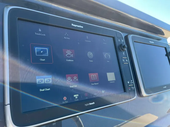  Yacht Photos Pics Control panel of a 2016 Azimut 77S yacht with Raymarine navigation displays.