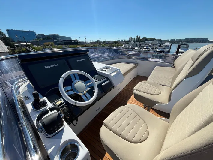  Yacht Photos Pics 2016 Azimut 77S yacht helm with modern controls and plush seating.