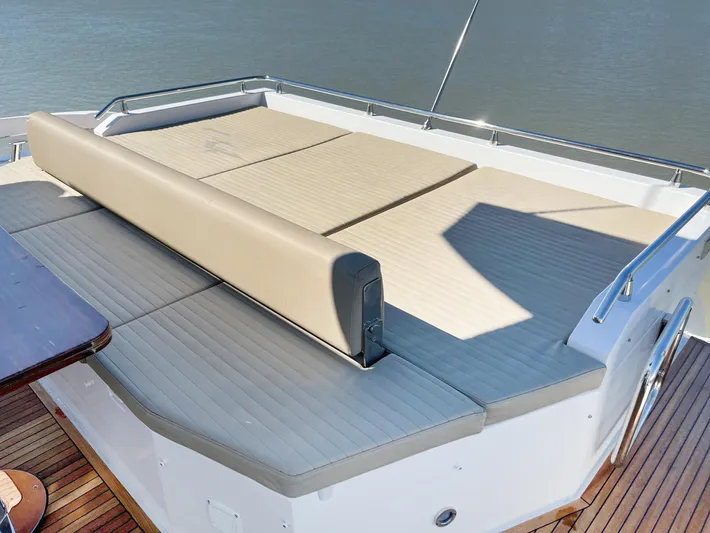  Yacht Photos Pics Luxury sunbathing deck on 2016 Azimut 77S yacht, featuring comfortable seating and elegant design.