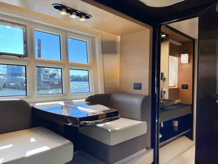  Yacht Photos Pics Luxurious interior of 2016 Azimut 77S yacht with elegant seating and large windows.