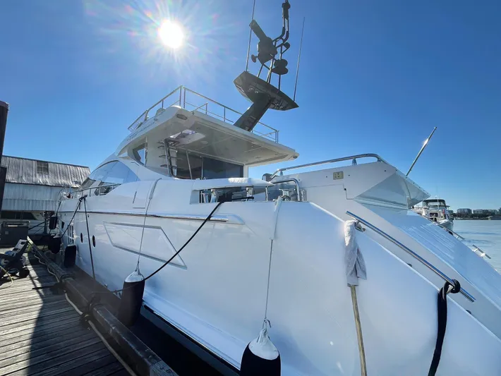  Yacht Photos Pics Luxury 2016 Azimut 77S yacht docked under clear blue sky.
