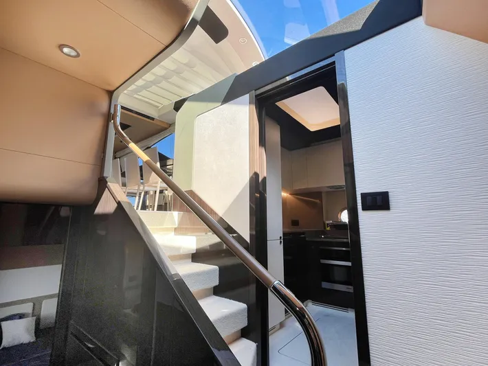  Yacht Photos Pics Interior view of 2016 Azimut 77S yacht, featuring modern staircase and sleek design.