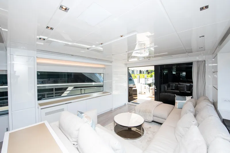 Echo Too - Sl78/753 Yacht Photos Pics Luxurious interior of 2022 Sanlorenzo SL78 yacht with modern furnishings and large windows.