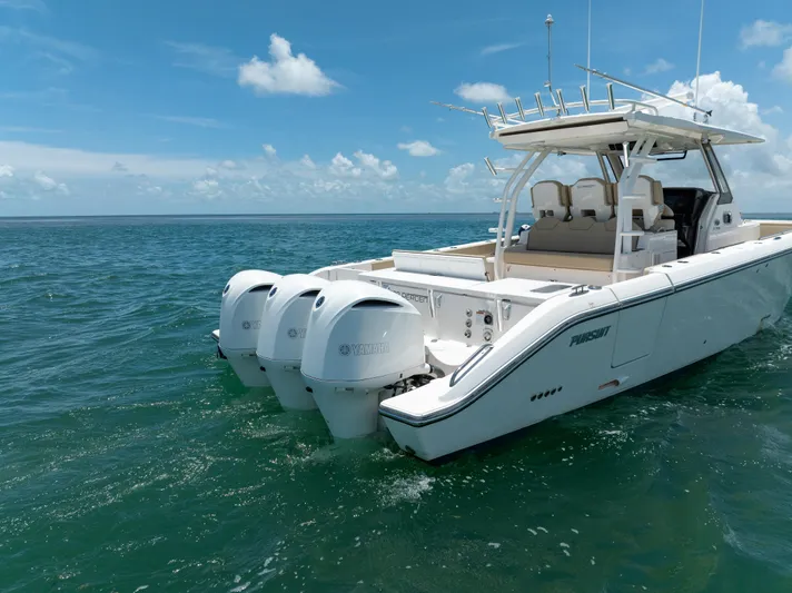 100 Percent Yacht Photos Pics 2018 Pursuit S 368 Sport boat with triple engines on open sea.