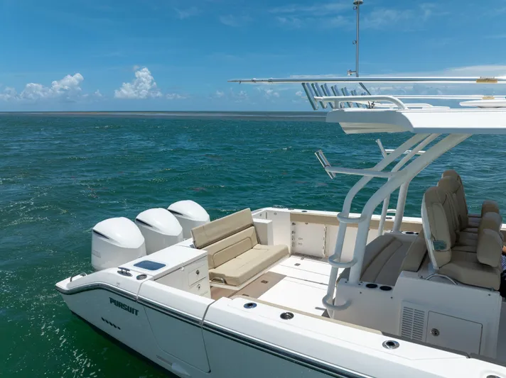 100 Percent Yacht Photos Pics 2018 Pursuit S 368 Sport boat on open water, featuring triple engines and spacious seating.