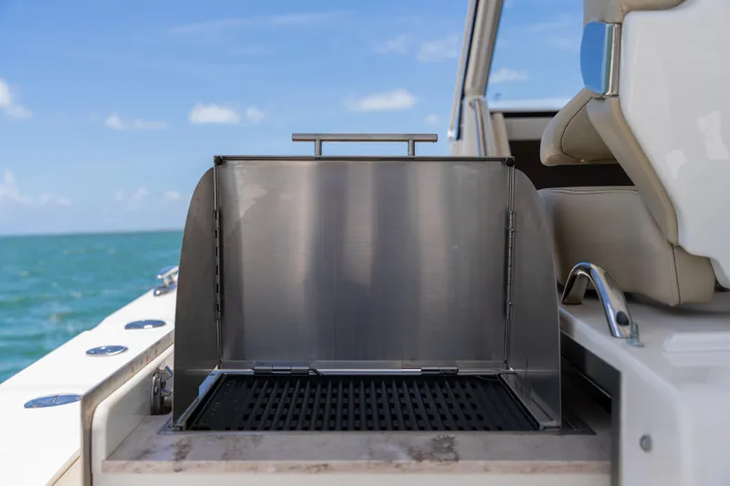100 Percent Yacht Photos Pics Stainless steel grill on 2018 Pursuit S 368 Sport boat, ocean view.