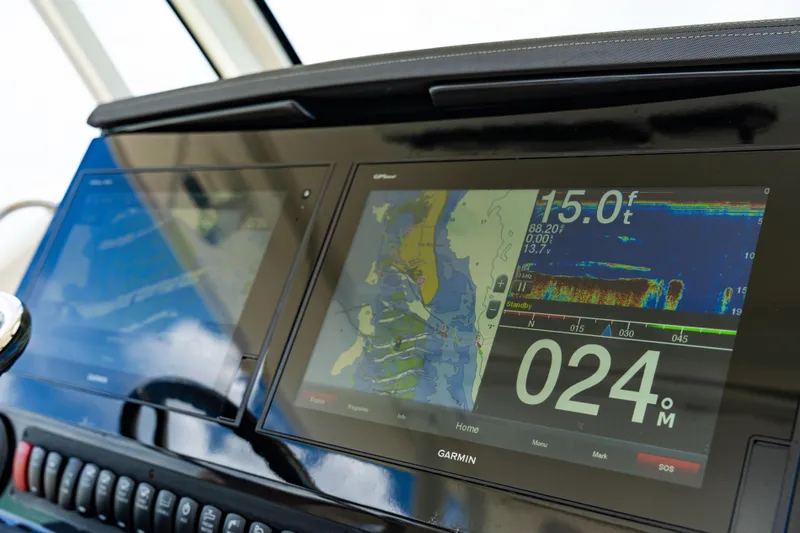 100 Percent Yacht Photos Pics Dashboard of 2018 Pursuit S 368 Sport boat with Garmin navigation display.