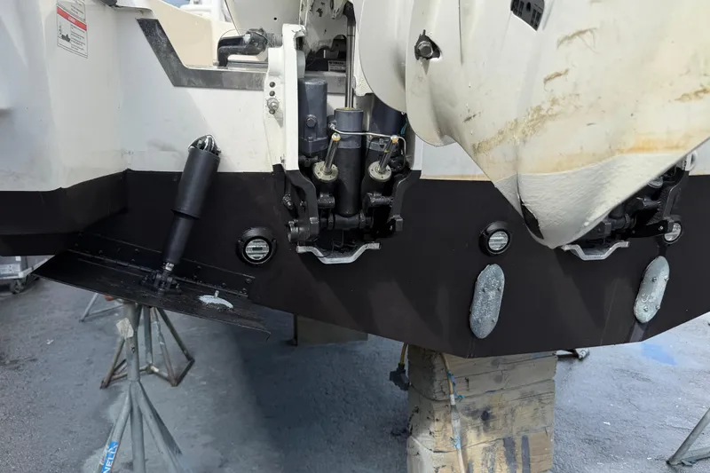 100 Percent Yacht Photos Pics 2018 Pursuit S 368 Sport boat's stern with outboard motor mounts and trim tabs.