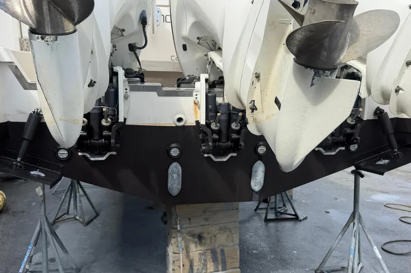 100 Percent Yacht Photos Pics 2018 Pursuit S 368 Sport boat with multiple outboard motors on stands.