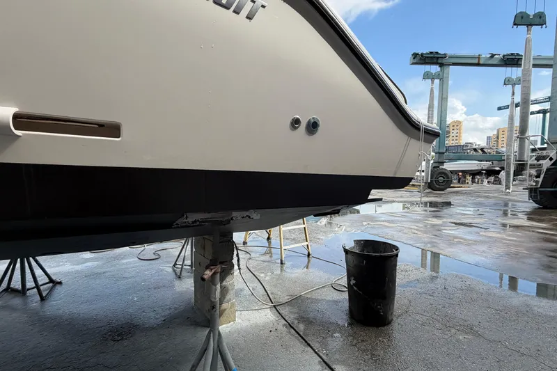 100 Percent Yacht Photos Pics 2018 Pursuit S 368 Sport boat in dry dock, undergoing maintenance.