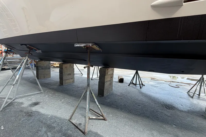 100 Percent Yacht Photos Pics 2018 Pursuit S 368 Sport boat hull on stands for maintenance.