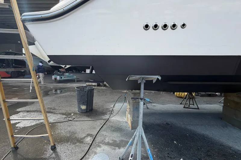 100 Percent Yacht Photos Pics 2018 Pursuit S 368 Sport boat under maintenance in a workshop.