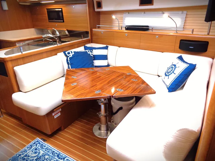 Meru Yacht Photos Pics Luxurious 2019 Catalina 425 yacht interior with elegant seating and wooden table.