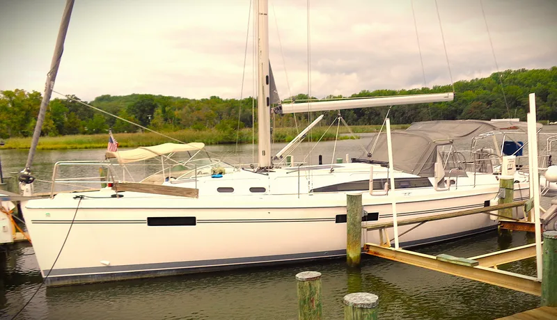 Meru Yacht Photos Pics 2019 Catalina 425 sailboat docked by a serene lakeside.