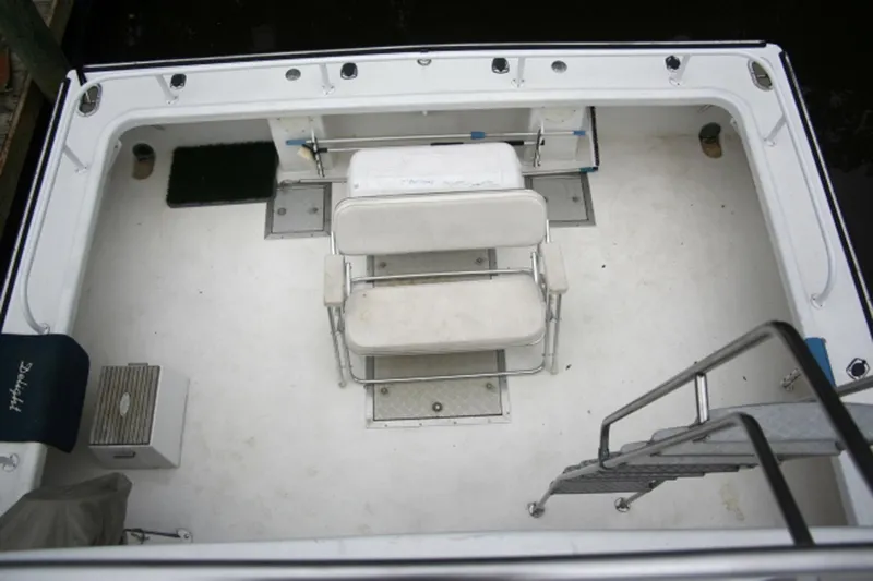 Delight Yacht Photos Pics 2002 Magna Marine 45 Flybridge boat deck with seating and ladder.