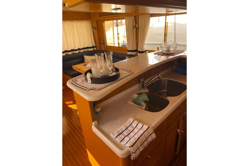  Yacht Photos Pics Interior of 2005 Selene 47 yacht with elegant kitchen and dining area.