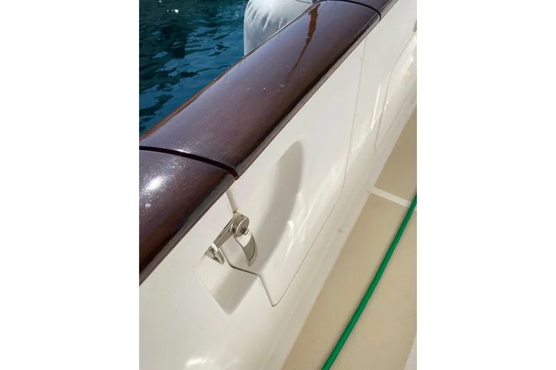  Yacht Photos Pics Close-up of 2005 Selene 47 yacht railing with polished wood finish.