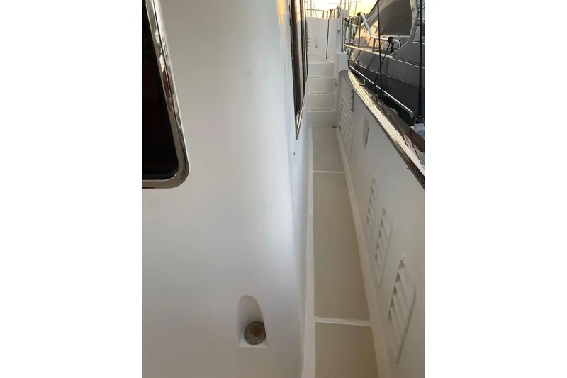  Yacht Photos Pics Narrow walkway on a 2005 Selene 47 yacht, showcasing sleek design and craftsmanship.