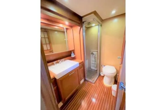  Yacht Photos Pics Luxurious bathroom in 2005 Selene 47 yacht with wood accents and modern fixtures.