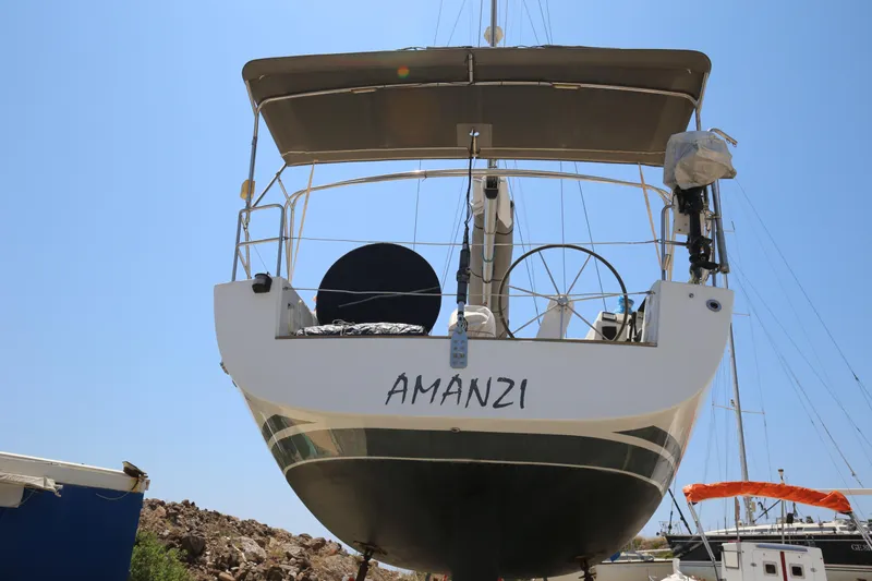  Yacht Photos Pics Hanse 430e sailboat from 2007, named "AMANZI," docked under clear blue sky.