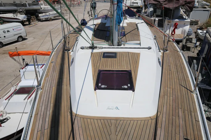  Yacht Photos Pics 2007 Hanse 430e sailboat with teak deck, docked in a marina.