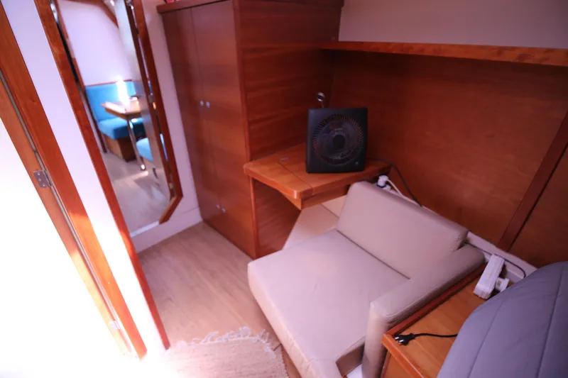  Yacht Photos Pics Interior of 2007 Hanse 430e yacht with cozy seating and wooden cabinetry.