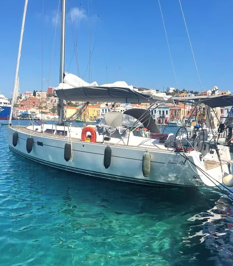  Yacht Photos Pics 2007 Hanse 430e sailboat docked in clear blue water, vibrant coastal town in background.