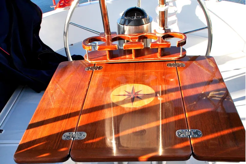 Fidelity Yacht Photos Pics Polished wooden table with compass design on 2010 Valiant 42 CE/SE yacht.