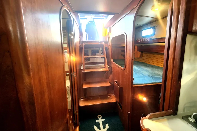 Fidelity Yacht Photos Pics Interior of 2010 Valiant 42 CE/SE sailboat with wooden finish and cozy cabin.