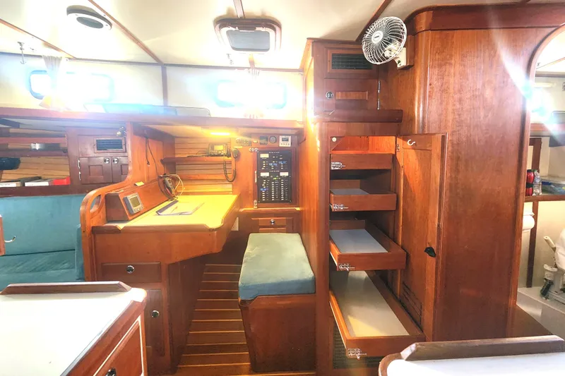 Fidelity Yacht Photos Pics Interior of 2010 Valiant 42 CE/SE yacht with wooden cabinetry and navigation station.