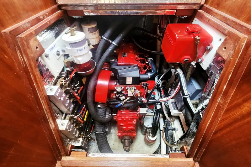 Fidelity Yacht Photos Pics Engine compartment of 2010 Valiant 42 CE/SE, featuring red engine and components.