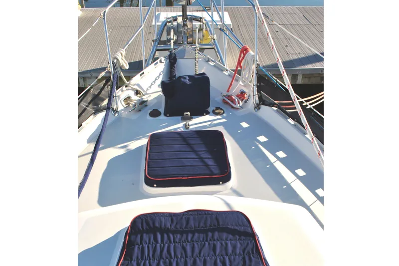 Fidelity Yacht Photos Pics Valiant 42 CE/SE 2010 sailboat deck with blue cushions and docked at marina.