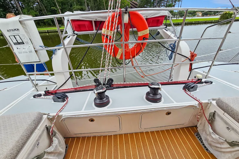 Surfer Girl Yacht Photos Pics 2018 Maine Cat 38 LS deck with winches, lifebuoy, and safety equipment.