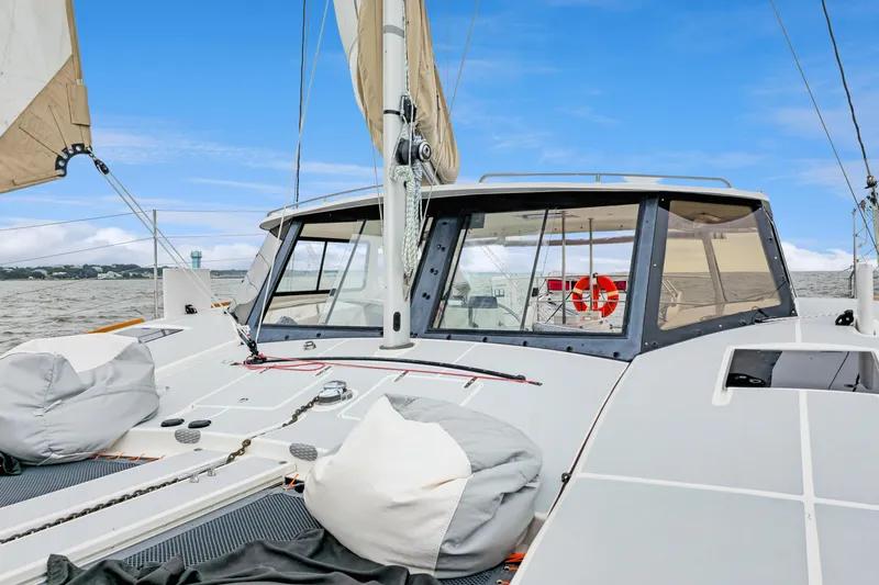 Surfer Girl Yacht Photos Pics 2018 Maine Cat 38 LS sailboat on water, featuring spacious deck and sails.