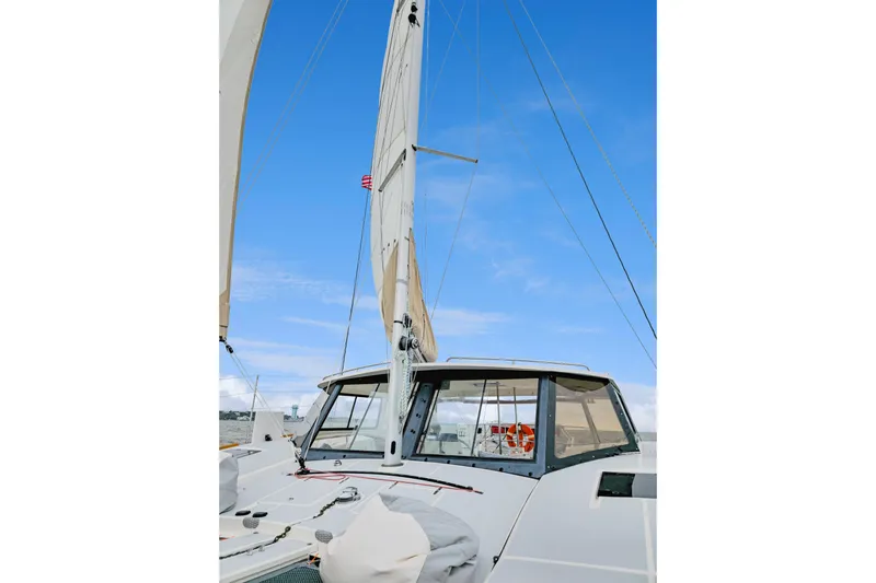 Surfer Girl Yacht Photos Pics 2018 Maine Cat 38 LS sailboat with sails up against a clear blue sky.