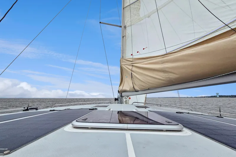 Surfer Girl Yacht Photos Pics 2018 Maine Cat 38 LS sailing on open water under clear blue skies.