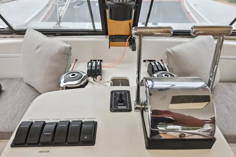 Surfer Girl Yacht Photos Pics Control panel of a 2018 Maine Cat 38 LS boat with throttle levers and switches.