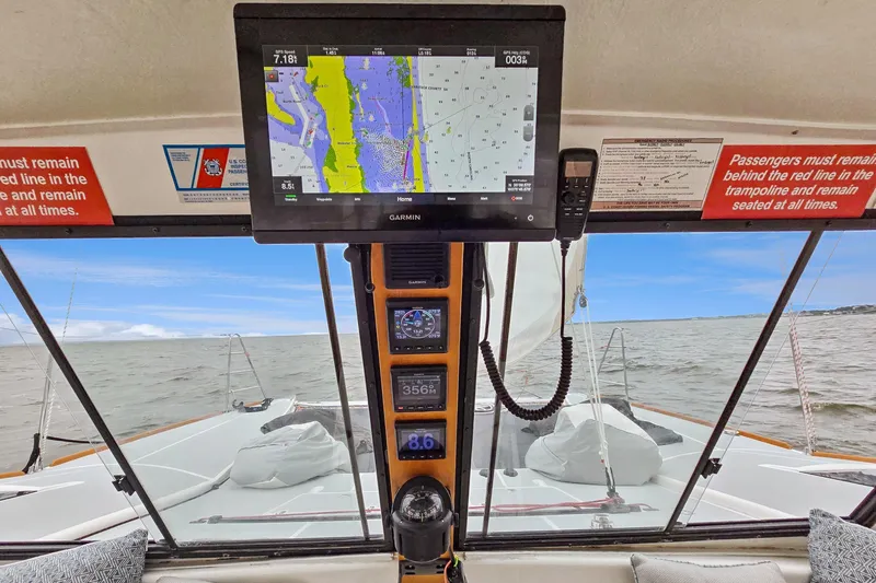 Surfer Girl Yacht Photos Pics Cockpit view of 2018 Maine Cat 38 LS with navigation display and ocean scenery.