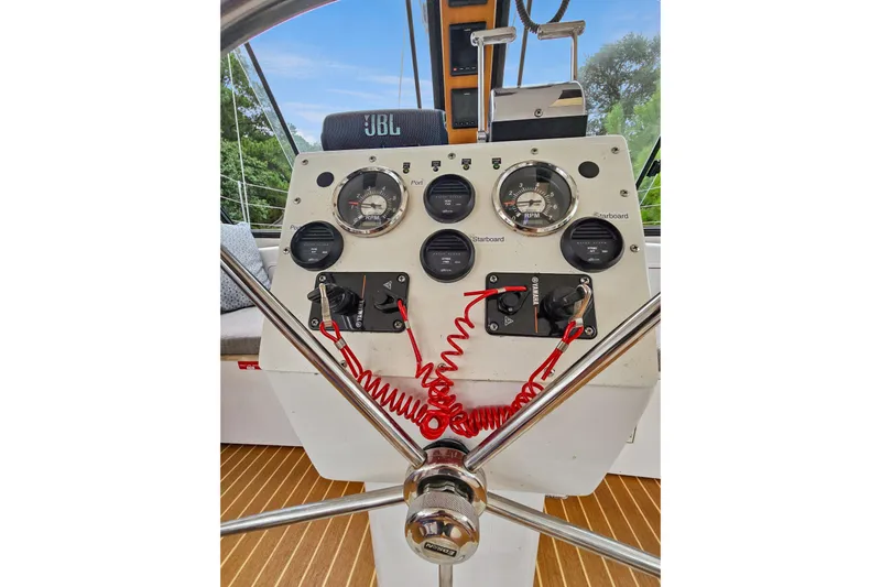 Surfer Girl Yacht Photos Pics Helm of 2018 Maine Cat 38 LS with gauges and controls, featuring a JBL speaker.