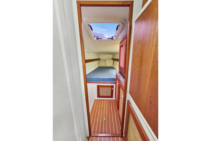 Surfer Girl Yacht Photos Pics Cozy cabin interior of 2018 Maine Cat 38 LS with wooden accents and skylight.