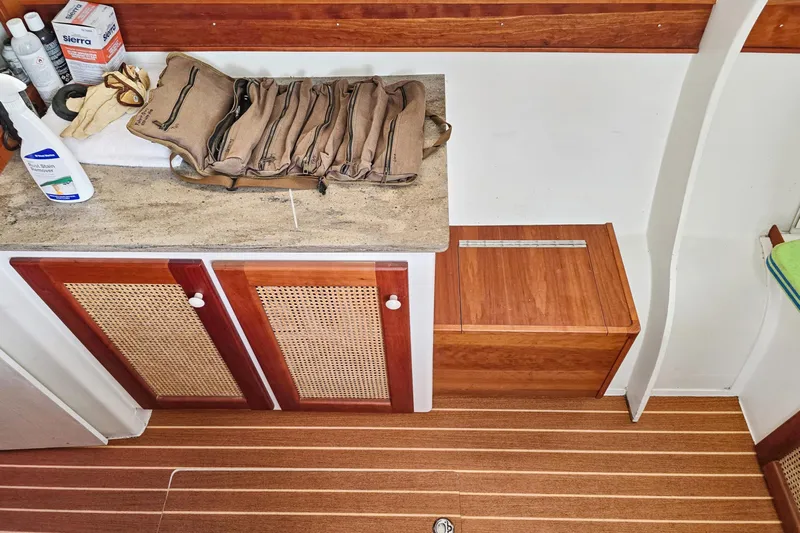 Surfer Girl Yacht Photos Pics Interior of 2018 Maine Cat 38 LS with wooden cabinetry and countertop accessories.