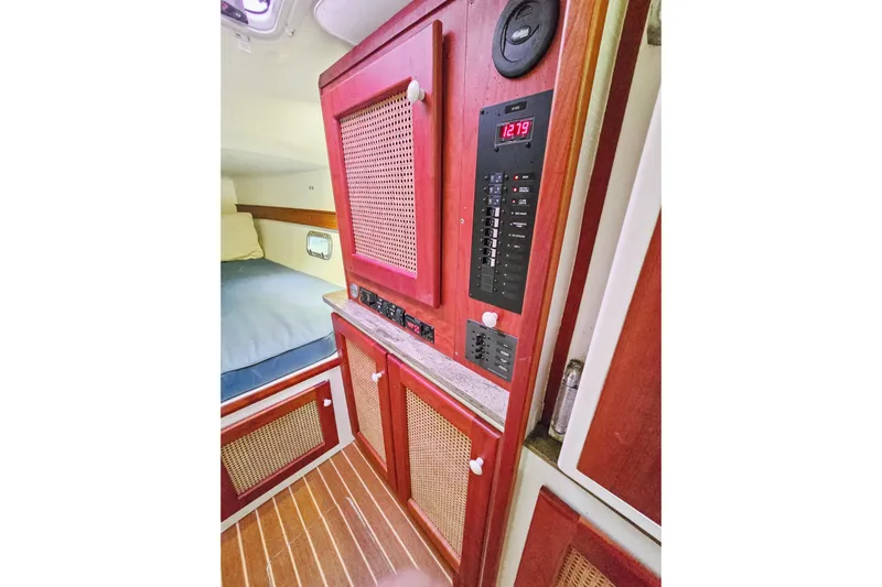 Surfer Girl Yacht Photos Pics Interior of 2018 Maine Cat 38 LS with wood cabinetry and control panel.