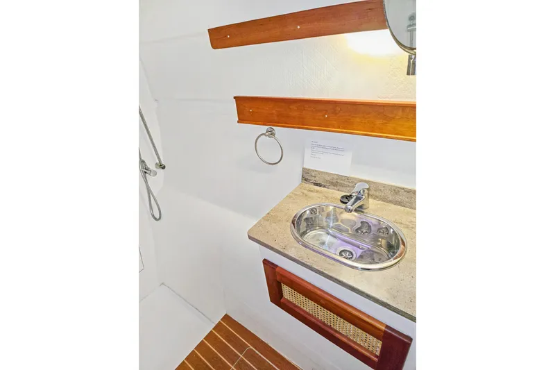 Surfer Girl Yacht Photos Pics Bathroom sink area in 2018 Maine Cat 38 LS yacht, featuring wooden accents and modern fixtures.