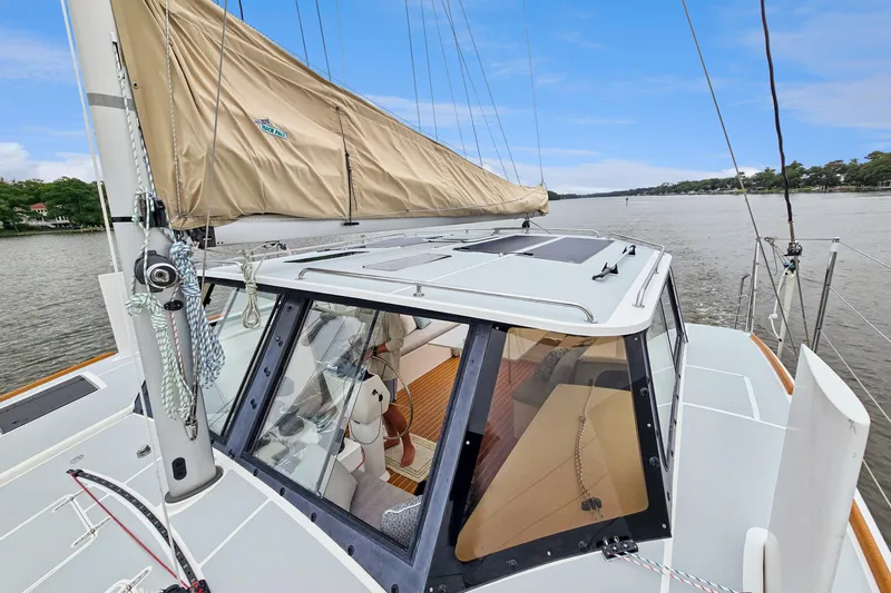 Surfer Girl Yacht Photos Pics 2018 Maine Cat 38 LS sailboat on calm water, featuring sleek design and spacious deck.