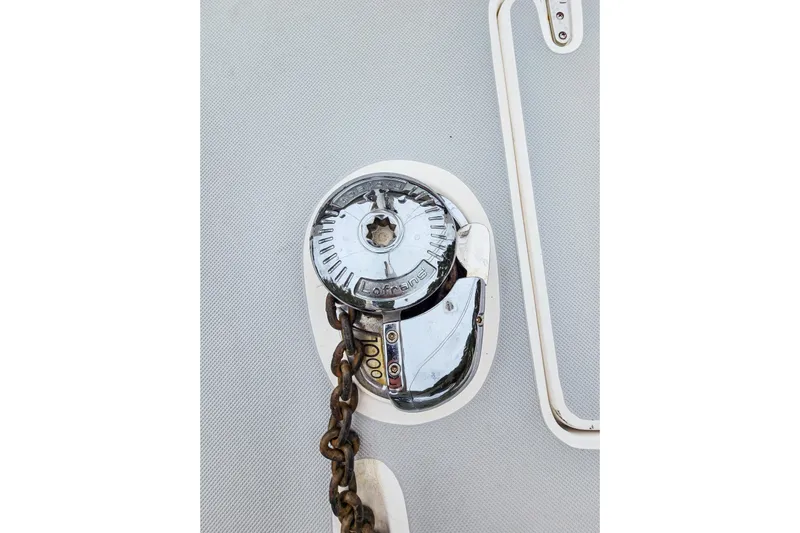 Surfer Girl Yacht Photos Pics Anchor windlass on 2018 Maine Cat 38 LS, featuring a metal chain and polished finish.