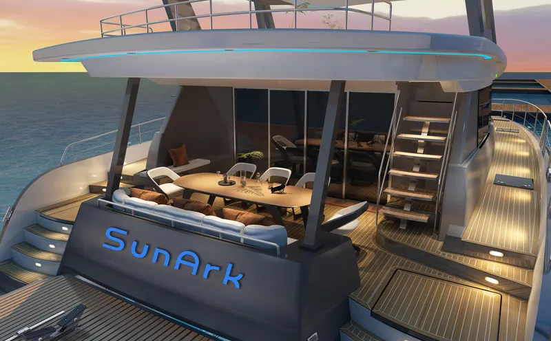  Yacht Photos Pics 2024 Mazarin 55 Catamaran Hybrid, luxury deck view at sunset, featuring "SunArk" branding.