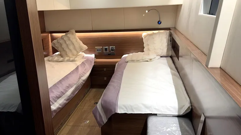  Yacht Photos Pics 2024 Mazarin 55 Catamaran HYBRID cabin with twin beds and modern wood finish.