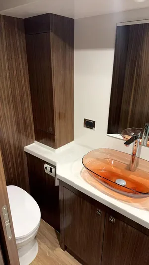  Yacht Photos Pics 2024 Mazarin 55 Catamaran Hybrid bathroom with modern design and glass sink.