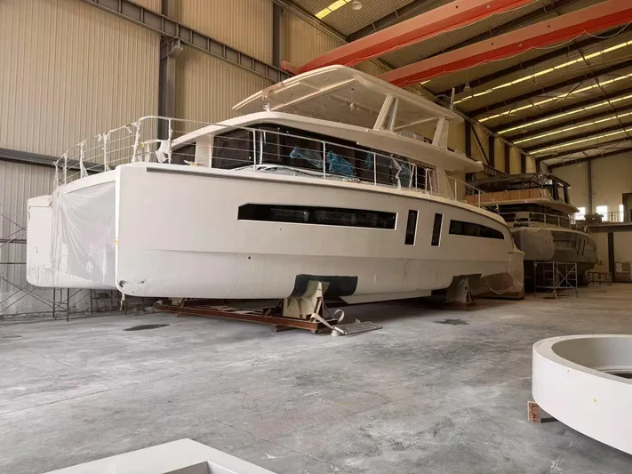  Yacht Photos Pics 2024 Mazarin 55 Catamaran Hybrid in a shipyard, under construction.