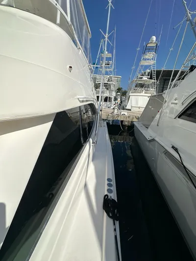 Yacht Photos Pics 2003 Riviera 40 Convertible yacht docked at a marina.